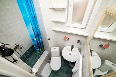 a small bathroom with a toilet and a sink at Apartment Resavska in Belgrade