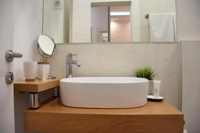 a bathroom with a white sink and a mirror at Royal park in Belgrade