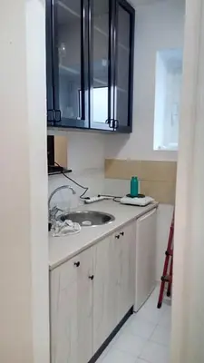 a kitchen with a sink and a mirror at Lola 1 in Belgrade