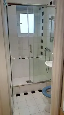 a bathroom with a shower and a toilet and a sink at Lola 1 in Belgrade