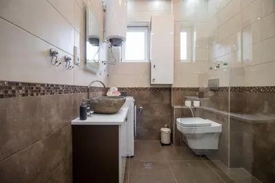 a bathroom with a sink and a toilet at Belgrade Downtown Residence in Belgrade