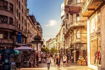 a group of people walking down a city street at Belgrade Downtown Residence in Belgrade