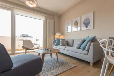 a living room with a couch and a table at Urban ZEN with View - City Break Apartments in Belgrade