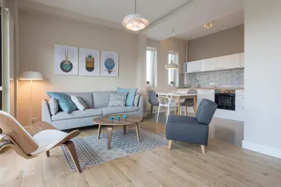 a living room with a couch and a table at Urban ZEN with View - City Break Apartments in Belgrade