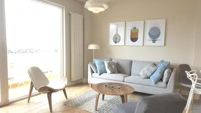 a living room with a couch and a table at Urban ZEN with View - City Break Apartments in Belgrade