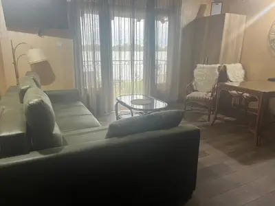 a living room with a couch and a table at Dunavska Kuća in Smederevo