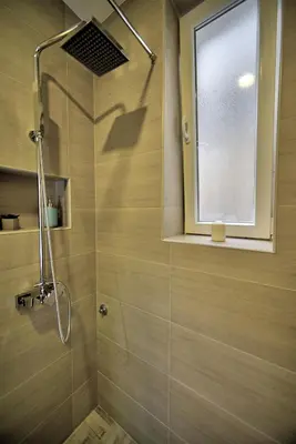 a bathroom with a shower with a glass door at Z&N luxury Belgrade appartment - city center in Belgrade