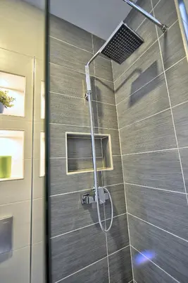 a shower in a bathroom with a glass door at Z&N luxury Belgrade appartment - city center in Belgrade