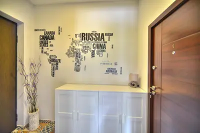 a room with a white cabinet with words on the wall at Z&N luxury Belgrade appartment - city center in Belgrade