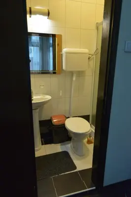 a bathroom with a toilet and a sink at Guesthouse Duga in Belgrade