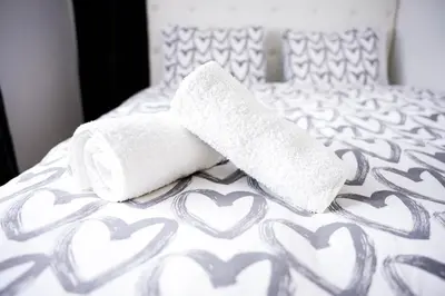 two towels on a bed with hearts on it at Gardos in Belgrade