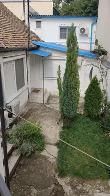 a house with two trees in front of it at Gardos in Belgrade