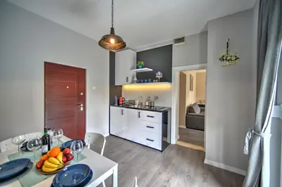 a kitchen with a table with fruits on it at H&M Lux appartment downtown NEW in Belgrade
