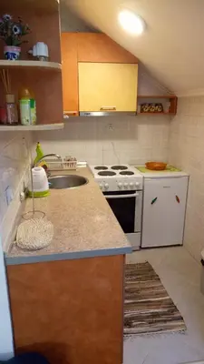a kitchen with a sink and a stove at Cozy studio Belgrade (Zemun) in Belgrade