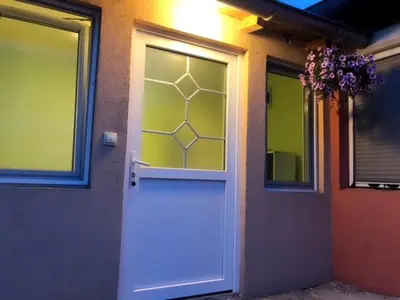 a front door of a house with a window at MARE Apartmant in Belgrade