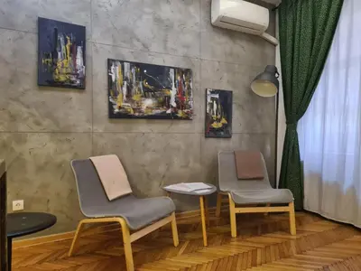 two chairs and a table in a waiting room at Urban Studio in city center in Belgrade