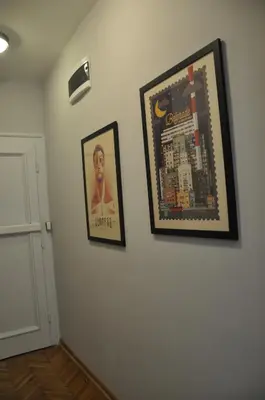 two pictures hanging on a wall in a room at Urban Studio in city center in Belgrade