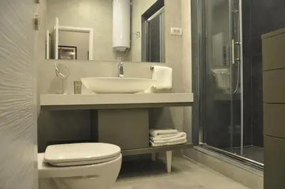 a bathroom with a sink and a toilet and a shower at Urban Studio in city center in Belgrade