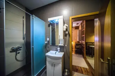 a bathroom with a sink and a mirror at Talismano Apartments in Smederevo