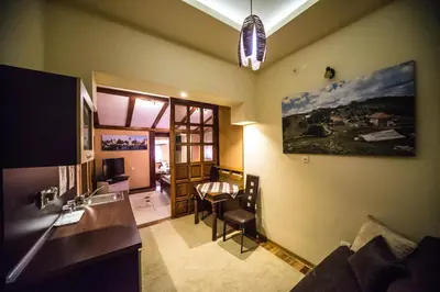 a living room with a kitchen and a dining room at Talismano Apartments in Smederevo