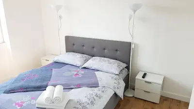 a bedroom with a bed with two towels on it at Krunska 54 in Belgrade