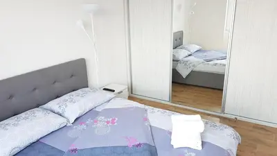 a bedroom with a bed and a mirror at Krunska 54 in Belgrade