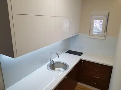 a small kitchen with a sink and a window at Krunska 54 in Belgrade