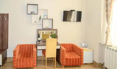 a dining room with a table and two chairs at Apartments Skadarlija in Belgrade