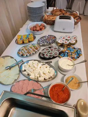 a table with many different food items on it at Konak Vukasinovic - FREE PARKING in Belgrade
