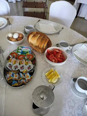 a table topped with plates of food and bowls of food at Konak Vukasinovic - FREE PARKING in Belgrade