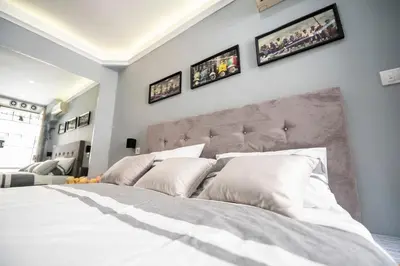 a bedroom with a large bed with white pillows at Marshal apartment in Belgrade