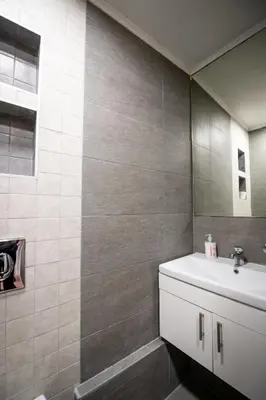 a bathroom with a sink and a mirror at Marshal apartment in Belgrade