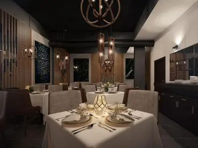 a restaurant with white tables and chairs and a chandelier at Hotel Ub Business & Wellness in Ub