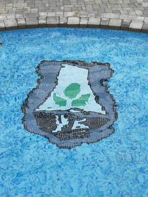a mosaic in the middle of a swimming pool at Hotel Ub Business & Wellness in Ub