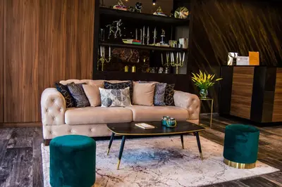 a living room with a couch and a table at Hotel Ub Business & Wellness in Ub