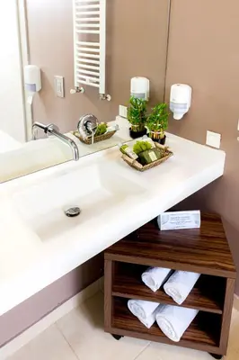 a bathroom with a sink and a mirror at Adresa Suites in Belgrade