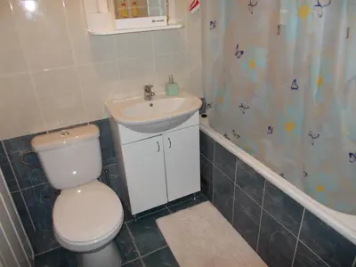 a bathroom with a toilet and a sink at MaryAnne in Ledine