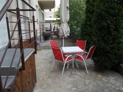 a table and chairs and an umbrella on a patio at MaryAnne in Ledine