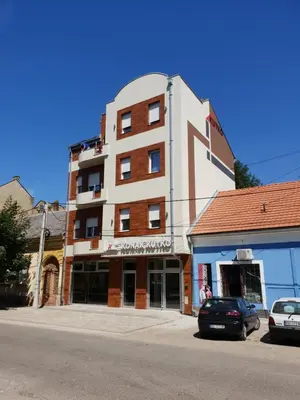 a building on the corner of a street at Konak Kutko in Pančevo