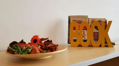 a bowl of food on a table next to a can of milk at Downtown Belgrade Hostel and Apartments in Belgrade