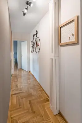 a bike hanging on a wall in a hallway at VortexLuxApatman in Belgrade