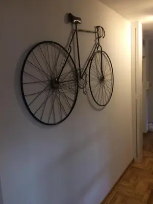 a bike hanging on a wall in a room at VortexLuxApatman in Belgrade