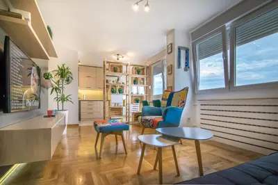a living room with a couch and a table at VortexLuxApatman in Belgrade