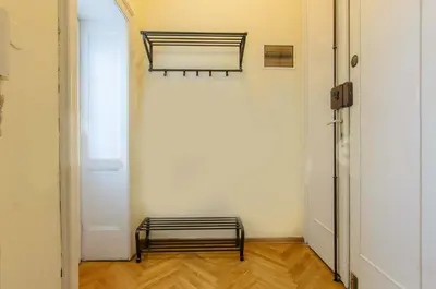 a hallway with a bench in the corner of a room at Gundulic in Belgrade