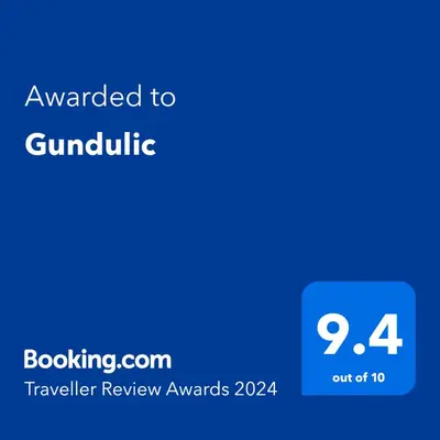 a blue text box with the words awarded to guindible at Gundulic in Belgrade