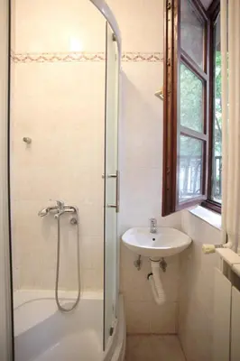 a bathroom with a shower and a sink at Studio Hram 2 in Belgrade