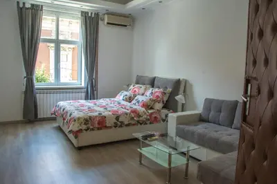 a living room with a bed and a couch at Apartment Petra 072 in Belgrade