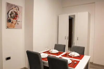 a dining room with a table and six chairs at Apartment Petra 072 in Belgrade
