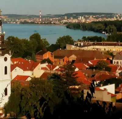 a view of a town with a river and a church at Beograd - apartman 