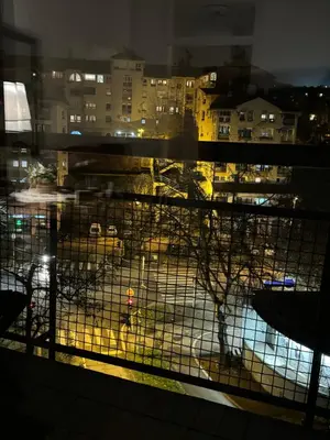 a view from a window of a city at night at Principessa Apartment in Belgrade